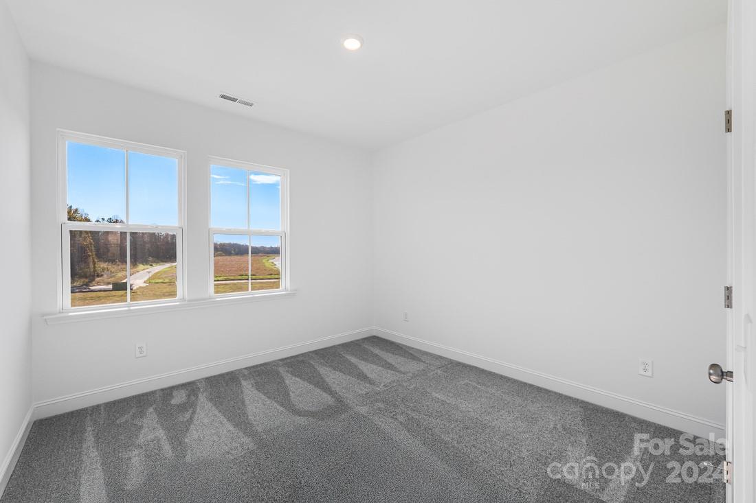 1156 Lost Cv Road Indian Land, SC 29707 - Photo 11 of 19 an empty room with windows