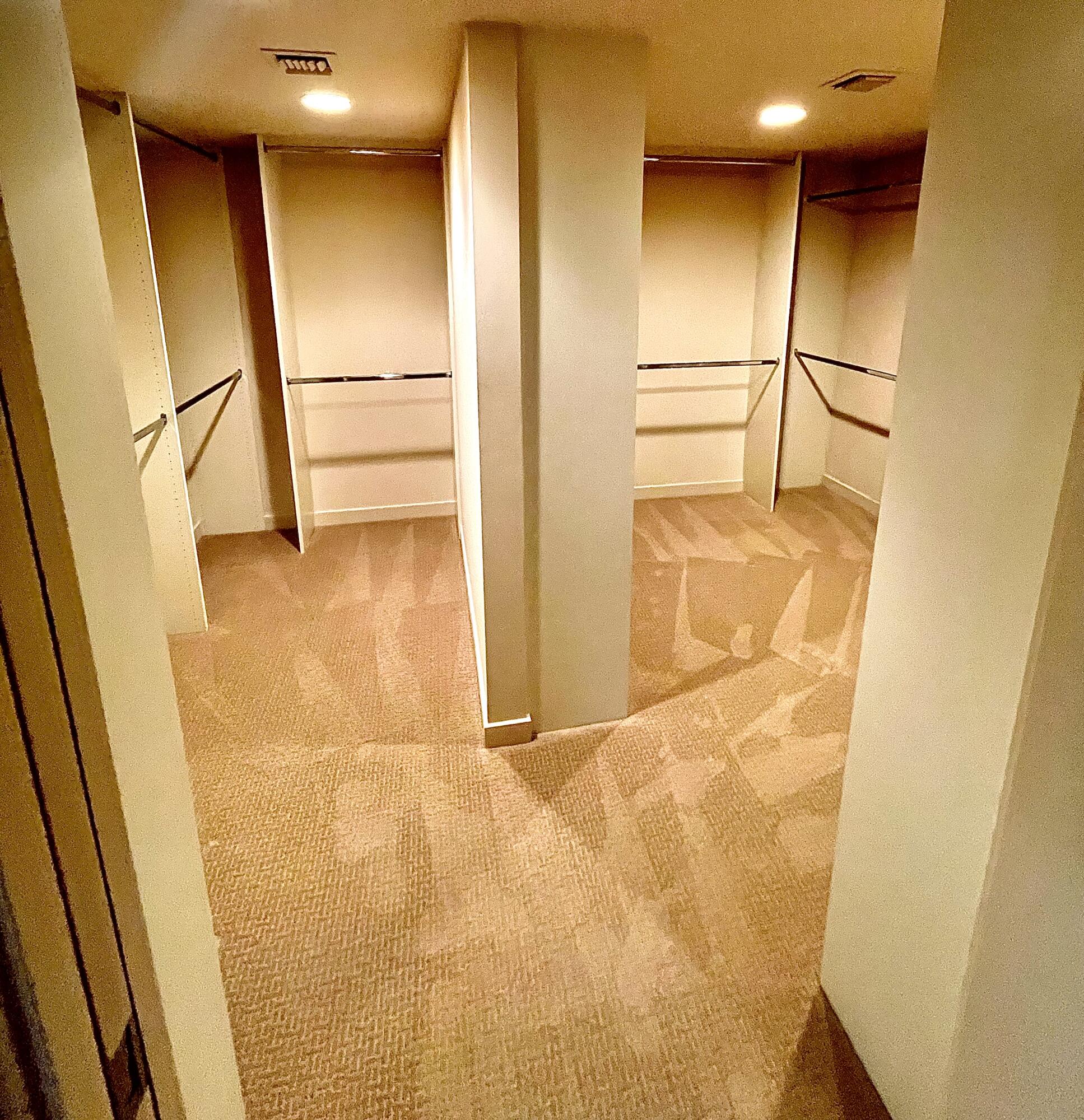 40281 Sand Dune Road Rancho Mirage, CA 92270 - Photo 25 of 41 a view of walk in closet with empty racks