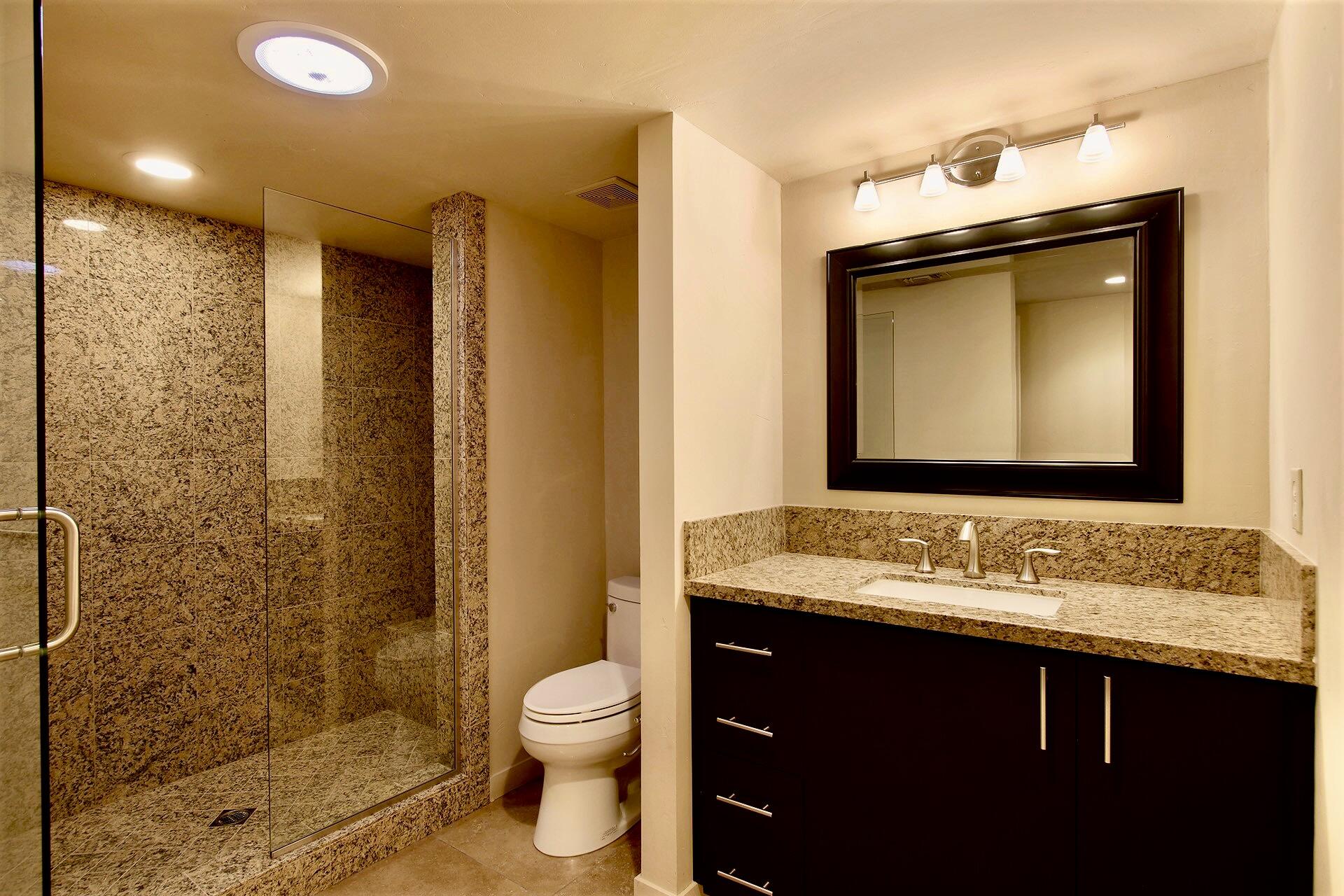 40281 Sand Dune Road Rancho Mirage, CA 92270 - Photo 30 of 41 a bathroom with a granite countertop sink toilet and shower