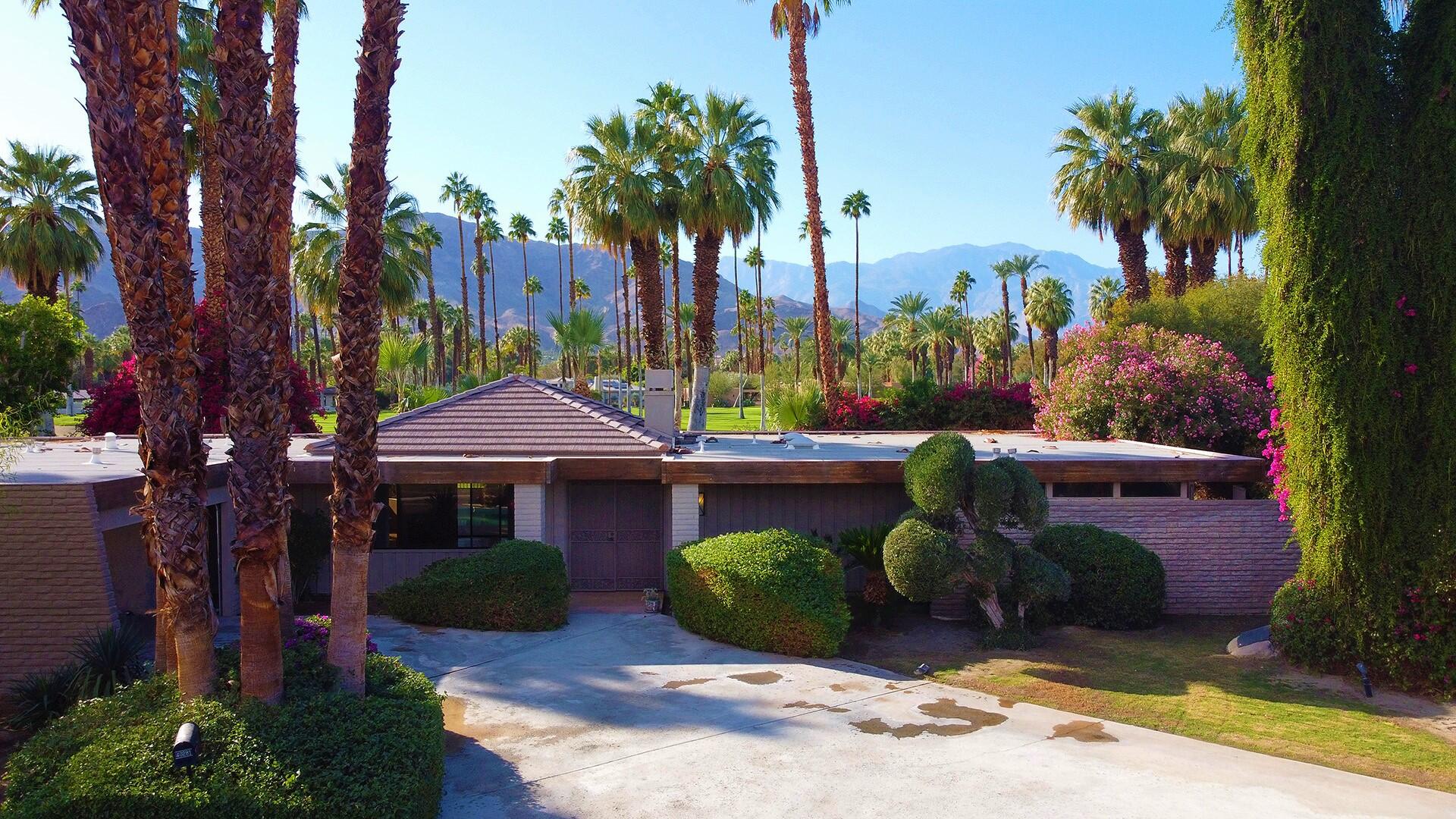 40281 Sand Dune Road Rancho Mirage, CA 92270 - Photo 34 of 41 a front view of a house with garden