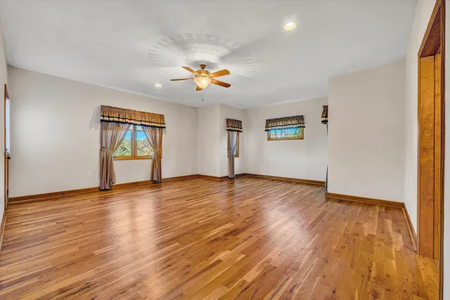 a spacious bathroom with a double vanity sink and a mirror