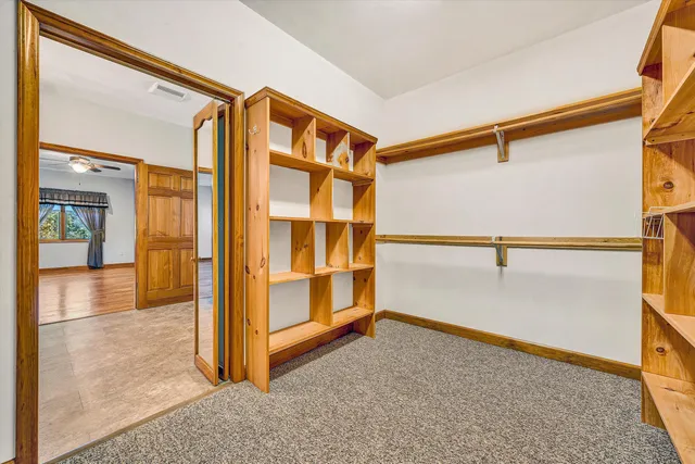 a kitchen with stainless steel appliances granite countertop a stove top oven a sink dishwasher a refrigerator and a stove