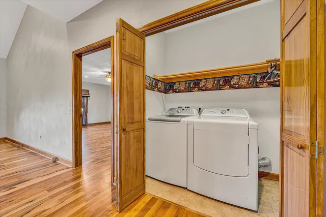 a view of a livingroom with a ceiling fan and window