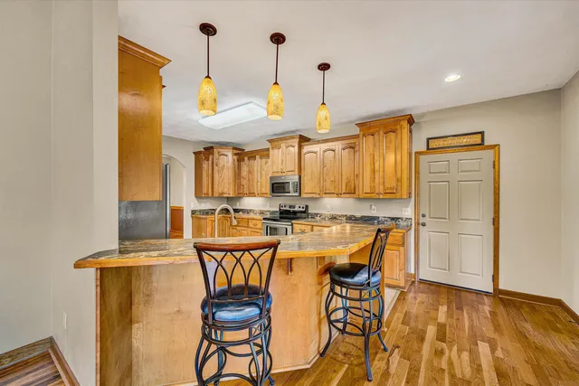a white toilet sitting next to a bathroom sink