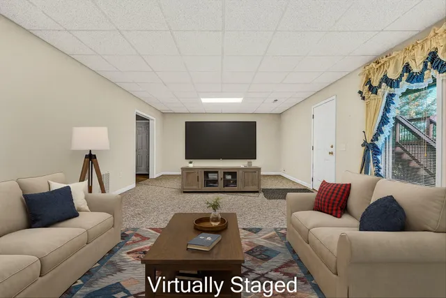 an aerial view of a house with a yard