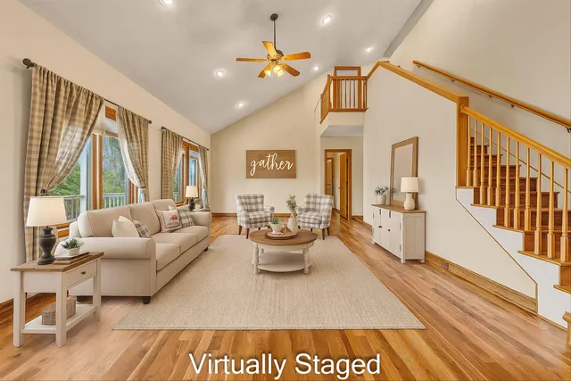 a view of a room with wooden floor and a window
