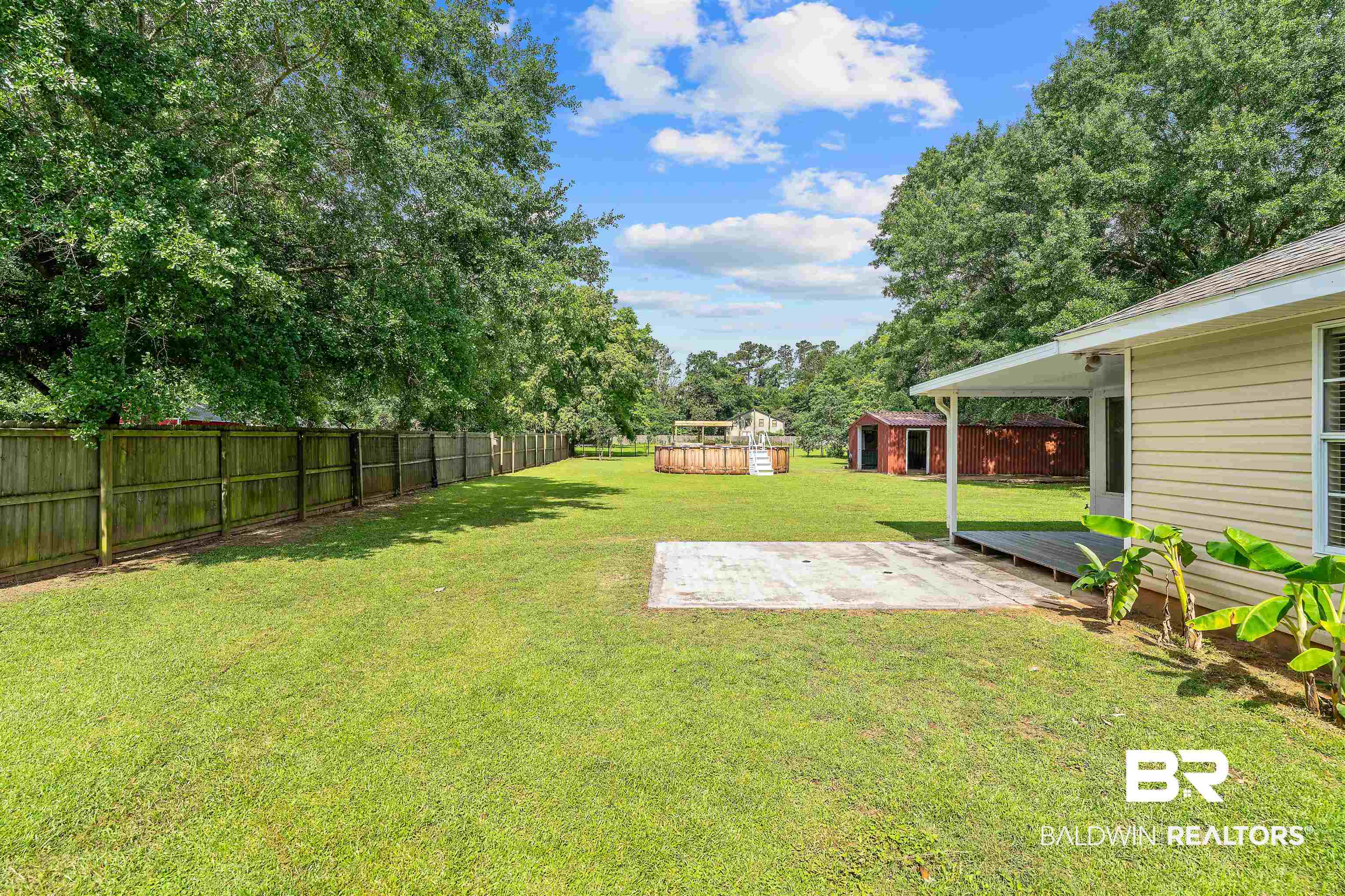 25779 Austin Road Daphne, AL 36526 - Photo 16 of 30 View of yard with a patio area and an outbuilding