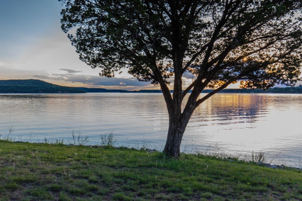 2334 San Bar Road, Unit 50 Graford, TX 76449 - Photo 4 of 40 a view of a lake from a yard