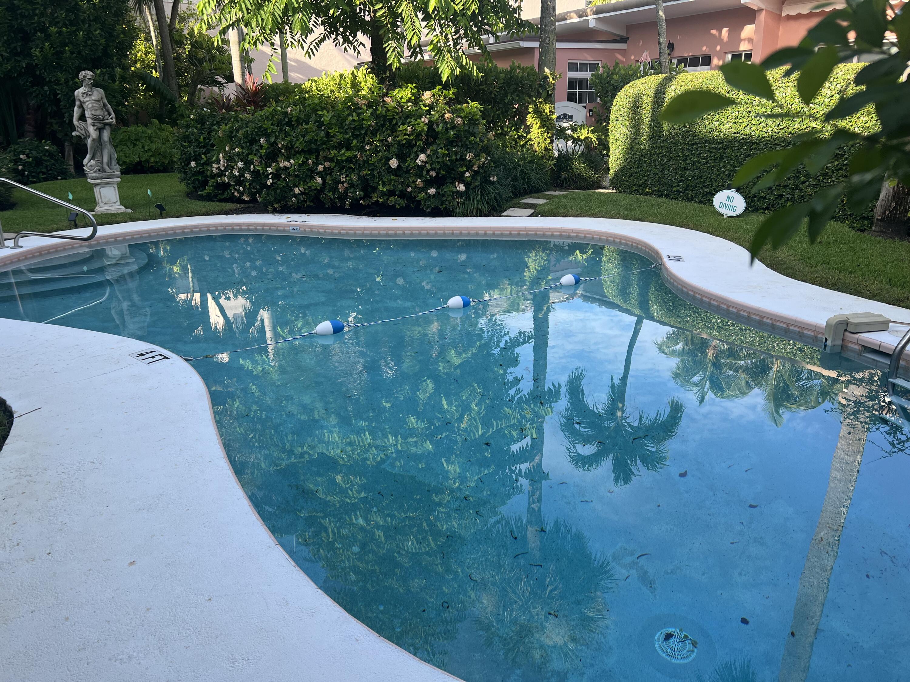 142 Peruvian Avenue, Unit 101 Palm Beach, FL 33480 - Photo 4 of 4 a view of a yard with a fountain