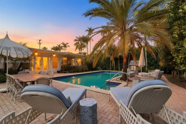 a view of a swimming pool with a patio