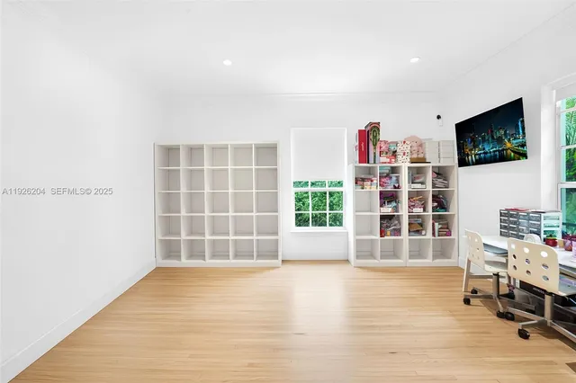 a large kitchen with stainless steel appliances granite countertop a stove and a sink