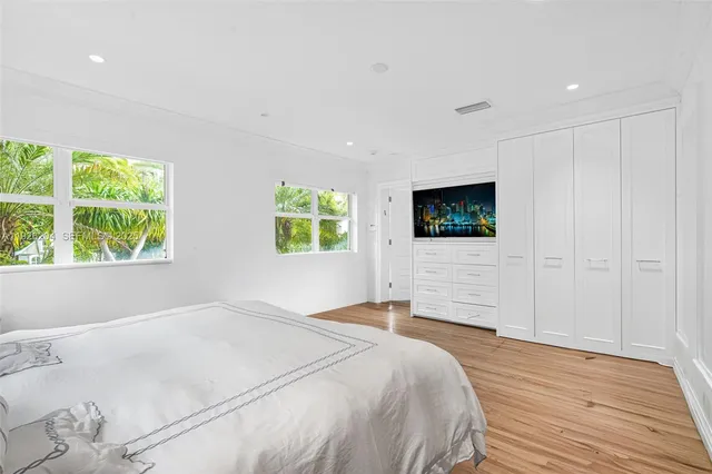 a bathroom with a double vanity sink mirror double and shower