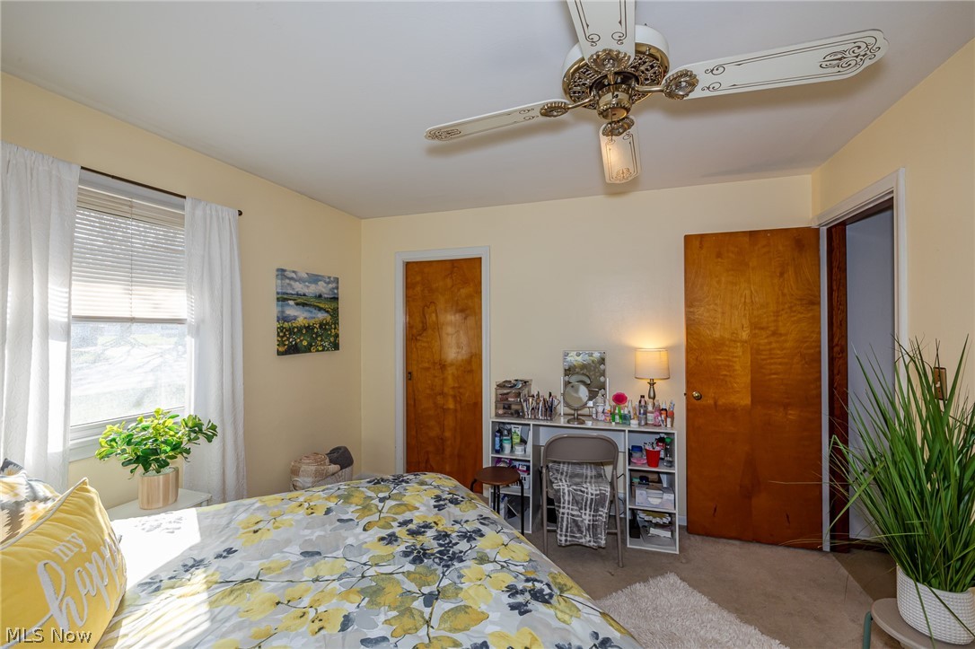 180 South Leavitt Road Amherst, OH 44001 - Photo 19 of 37 Bedroom with light colored carpet and ceiling fan