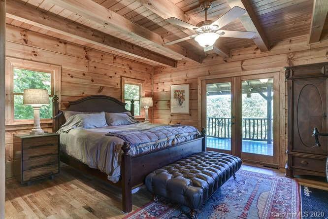 110 Cornerstone Ridge Waynesville, NC 28786 - Photo 21 of 33 a bedroom with a bed next to a window with outer view