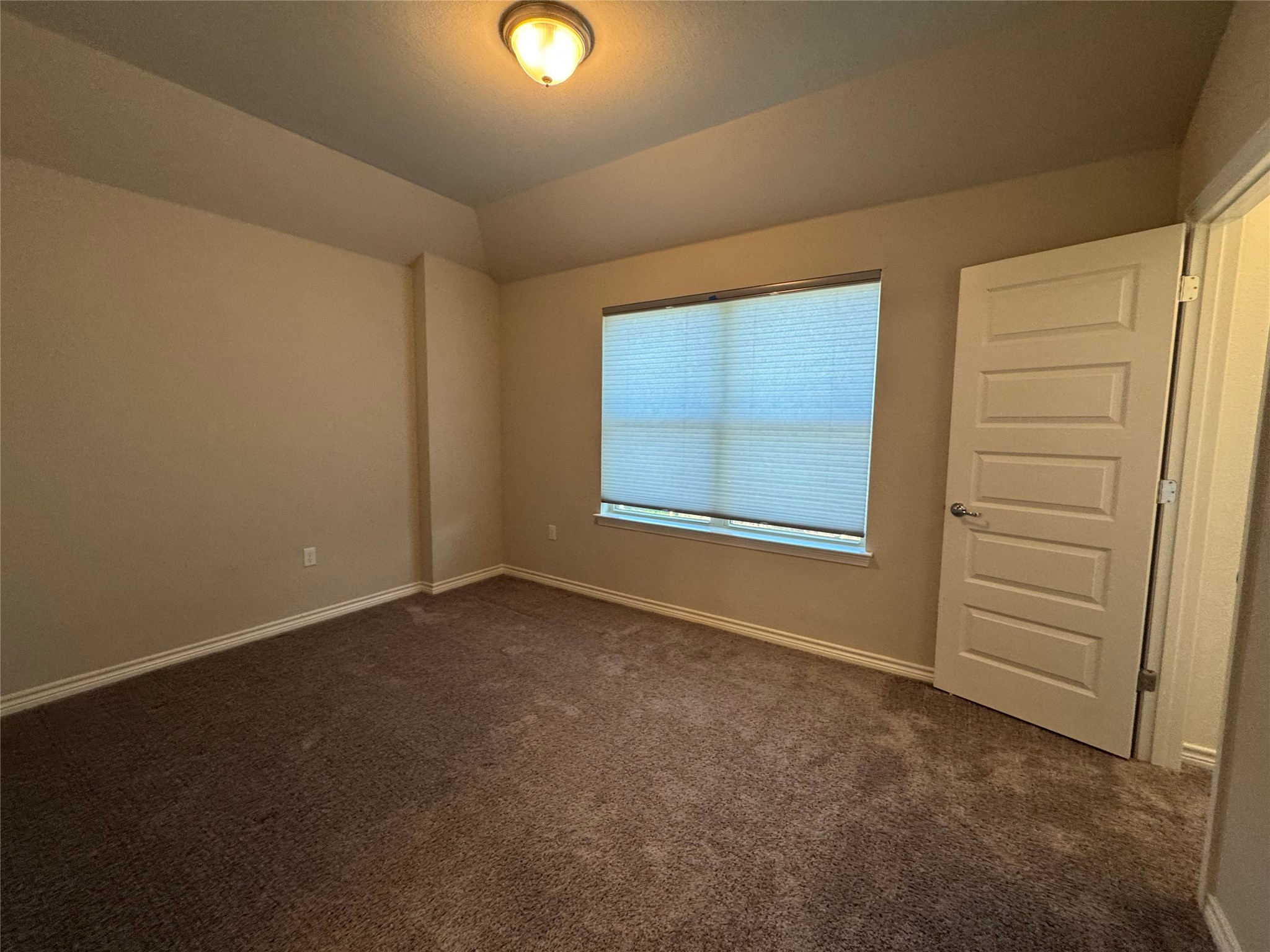 14100 McCoy Loop, Unit 1 Austin, TX 78717 - Photo 22 of 39 A comfortable bedroom with soft carpeting and ample natural light, ideal for relaxation.