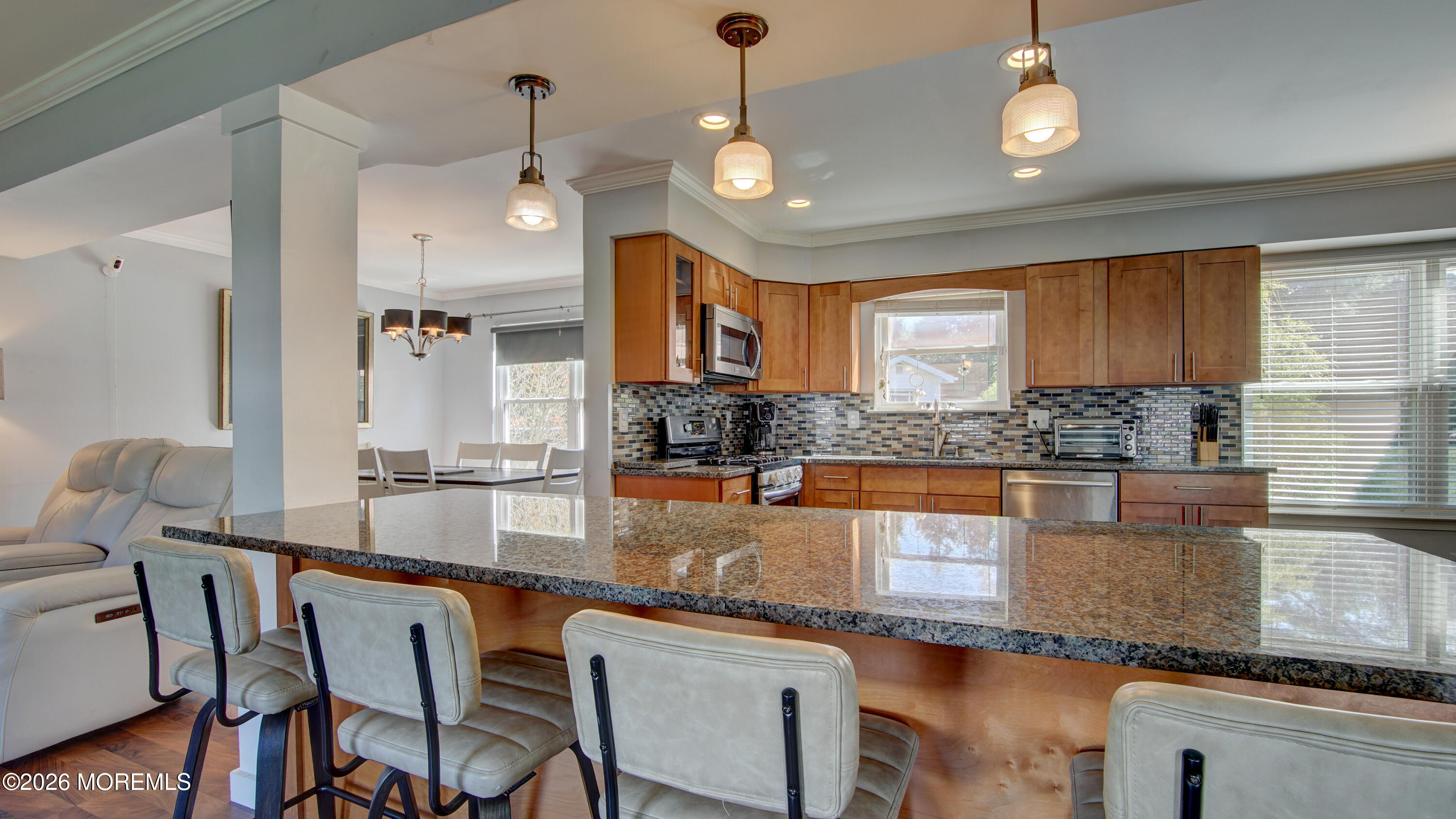 128 Starlight Road Howell, NJ 07731 - Photo 11 of 36 a kitchen with granite countertop counter space a sink cabinets and appliances