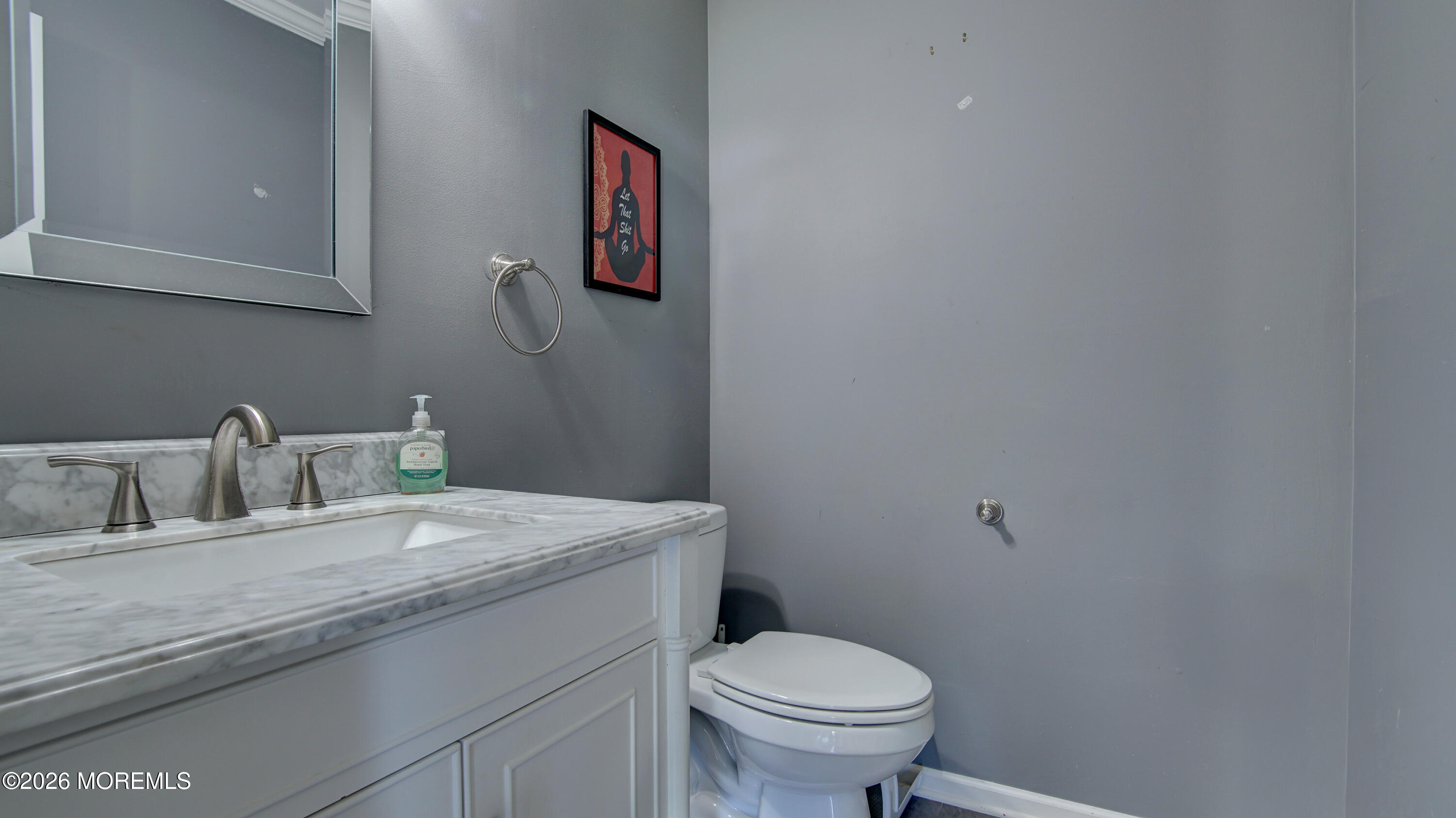 128 Starlight Road Howell, NJ 07731 - Photo 13 of 36 a bathroom with a granite countertop toilet sink and mirror
