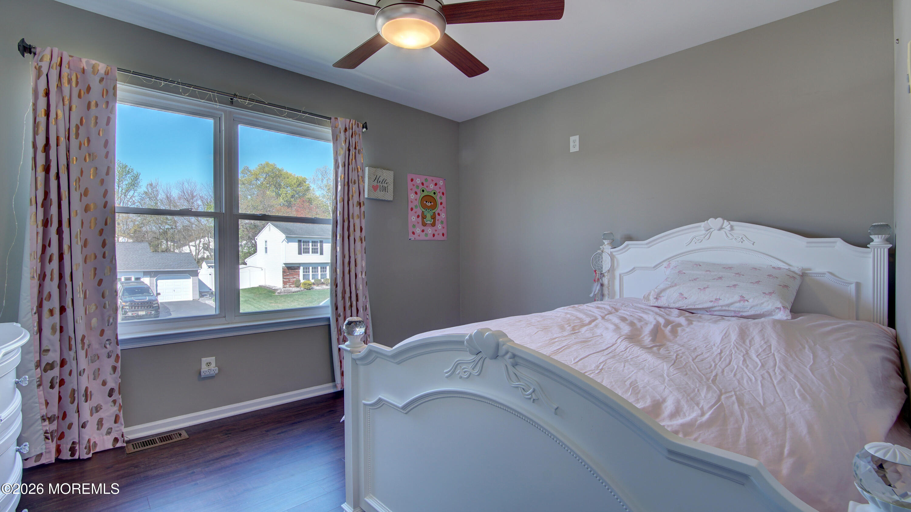 128 Starlight Road Howell, NJ 07731 - Photo 14 of 36 a bedroom with a large bed and a chandelier