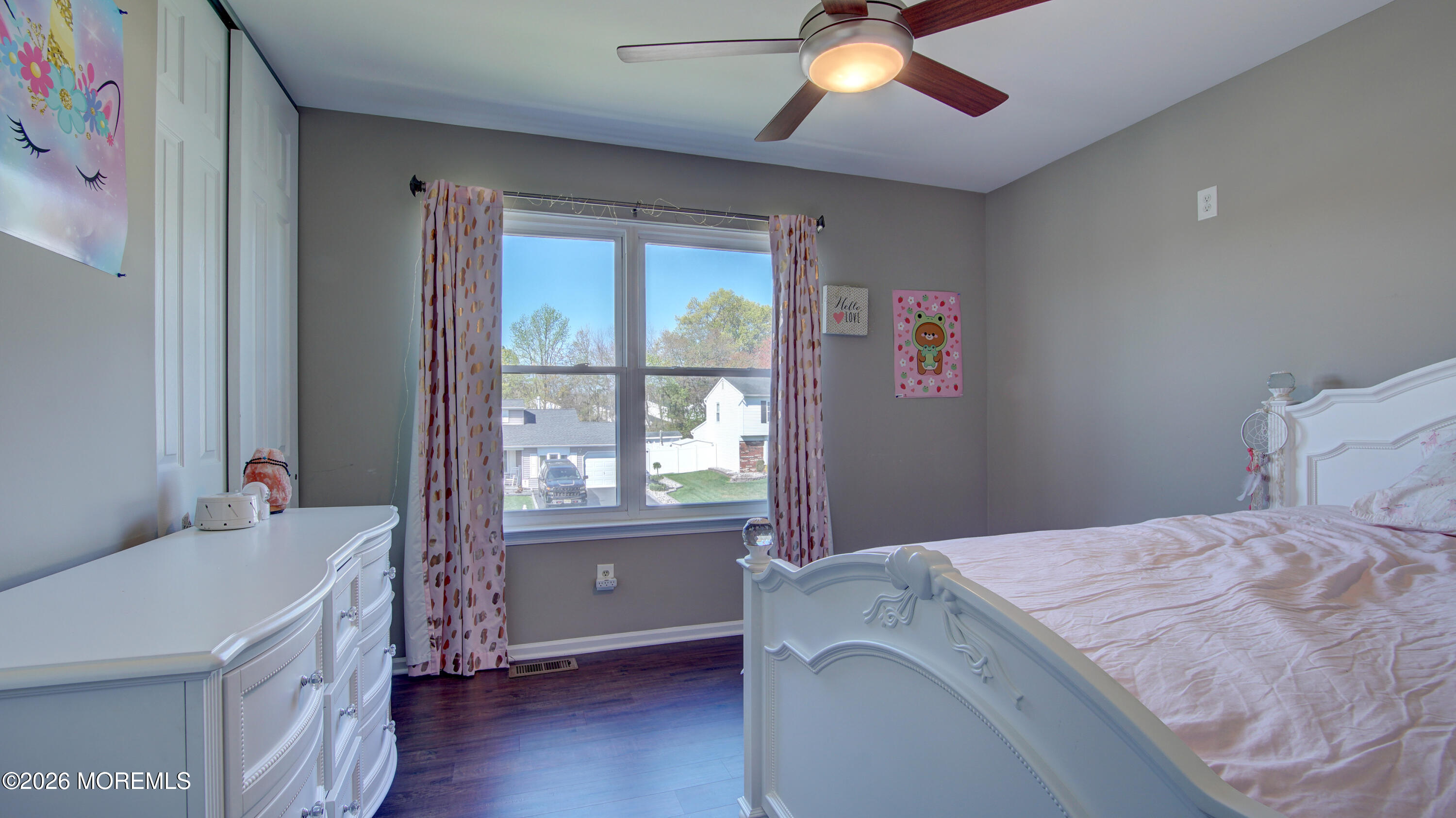128 Starlight Road Howell, NJ 07731 - Photo 15 of 36 a room with a bed and a chandelier