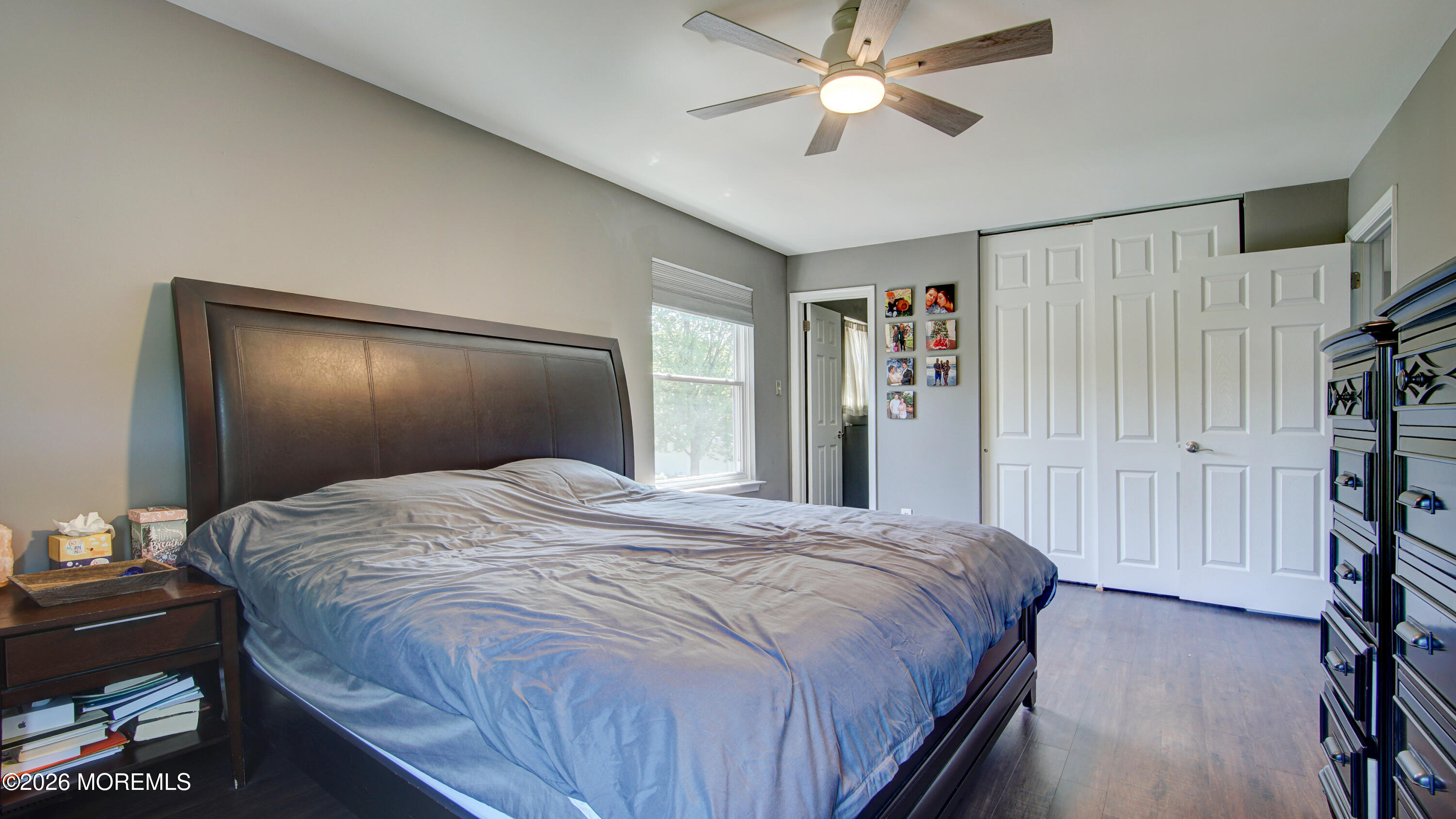 128 Starlight Road Howell, NJ 07731 - Photo 19 of 36 a bedroom with a large bed and a chandelier