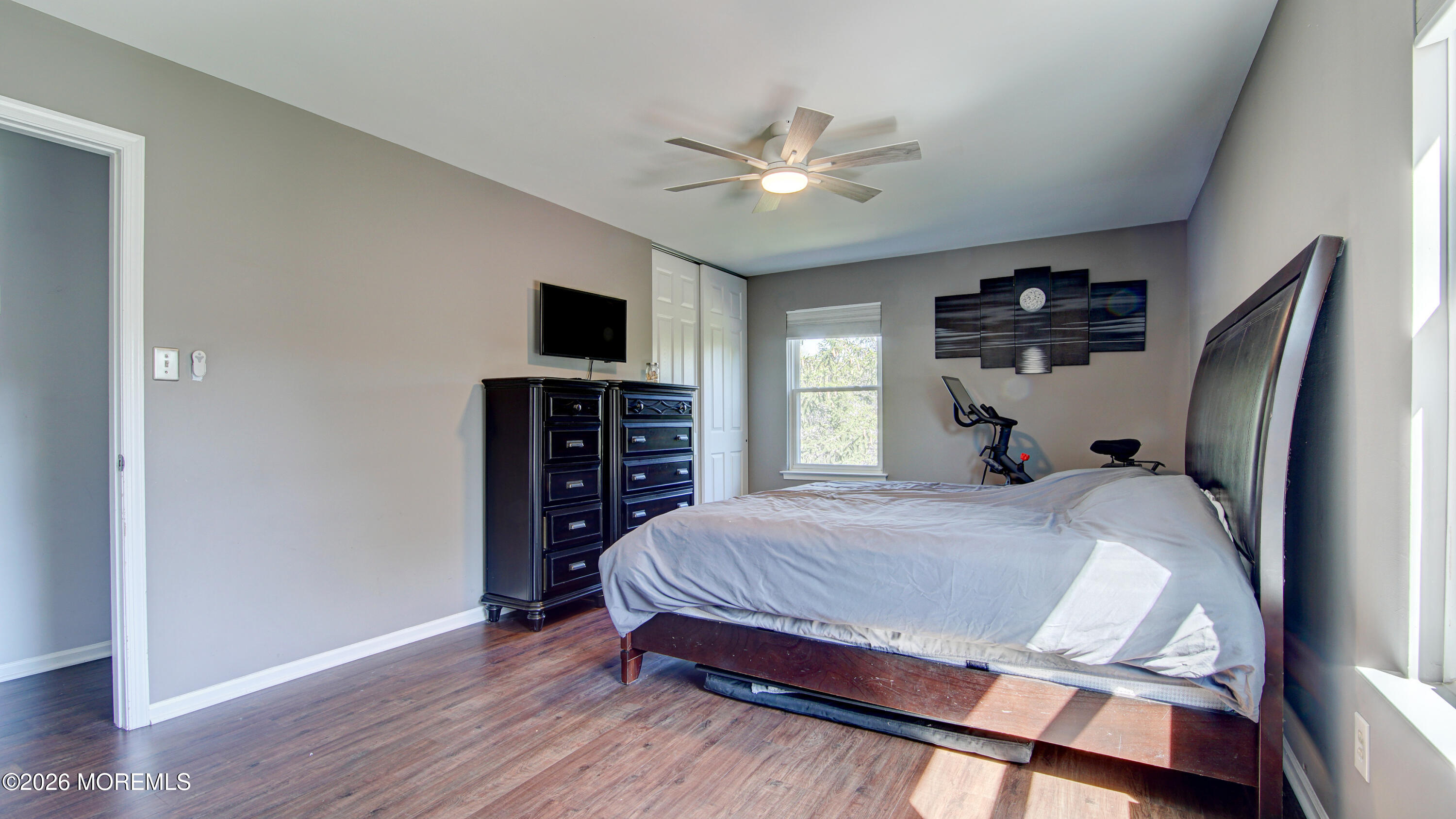 128 Starlight Road Howell, NJ 07731 - Photo 20 of 36 a bedroom with a bed and a flat screen tv