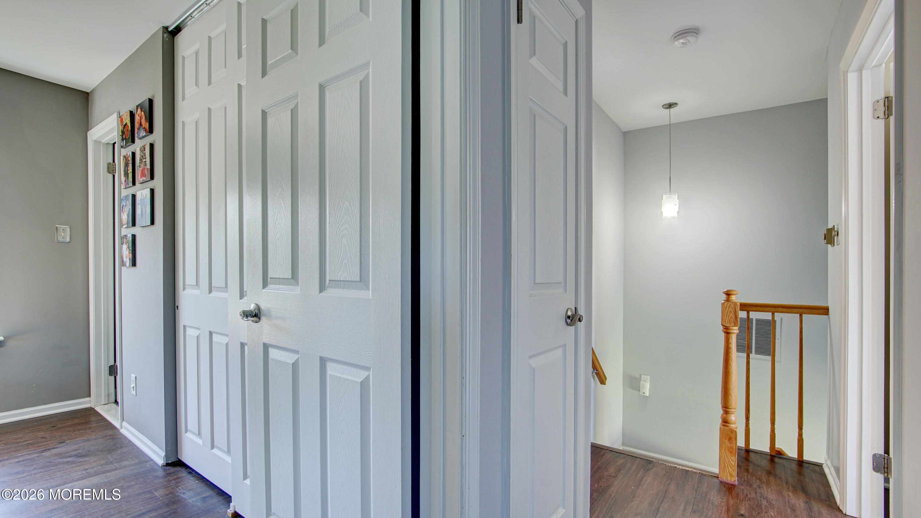 128 Starlight Road Howell, NJ 07731 - Photo 22 of 36 a view of a hallway with wooden floor and staircase