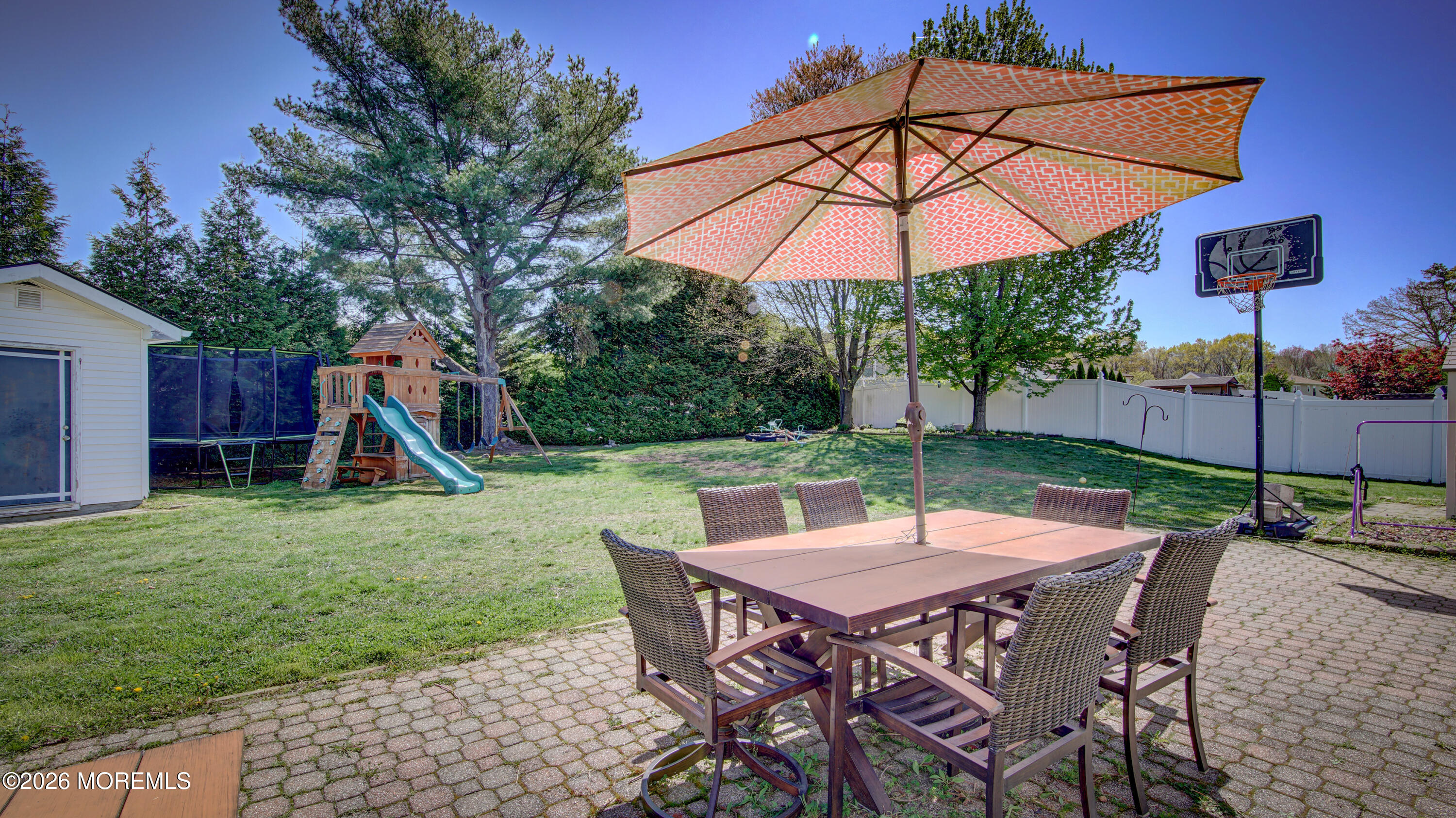 128 Starlight Road Howell, NJ 07731 - Photo 26 of 36 a table and chairs in the garden