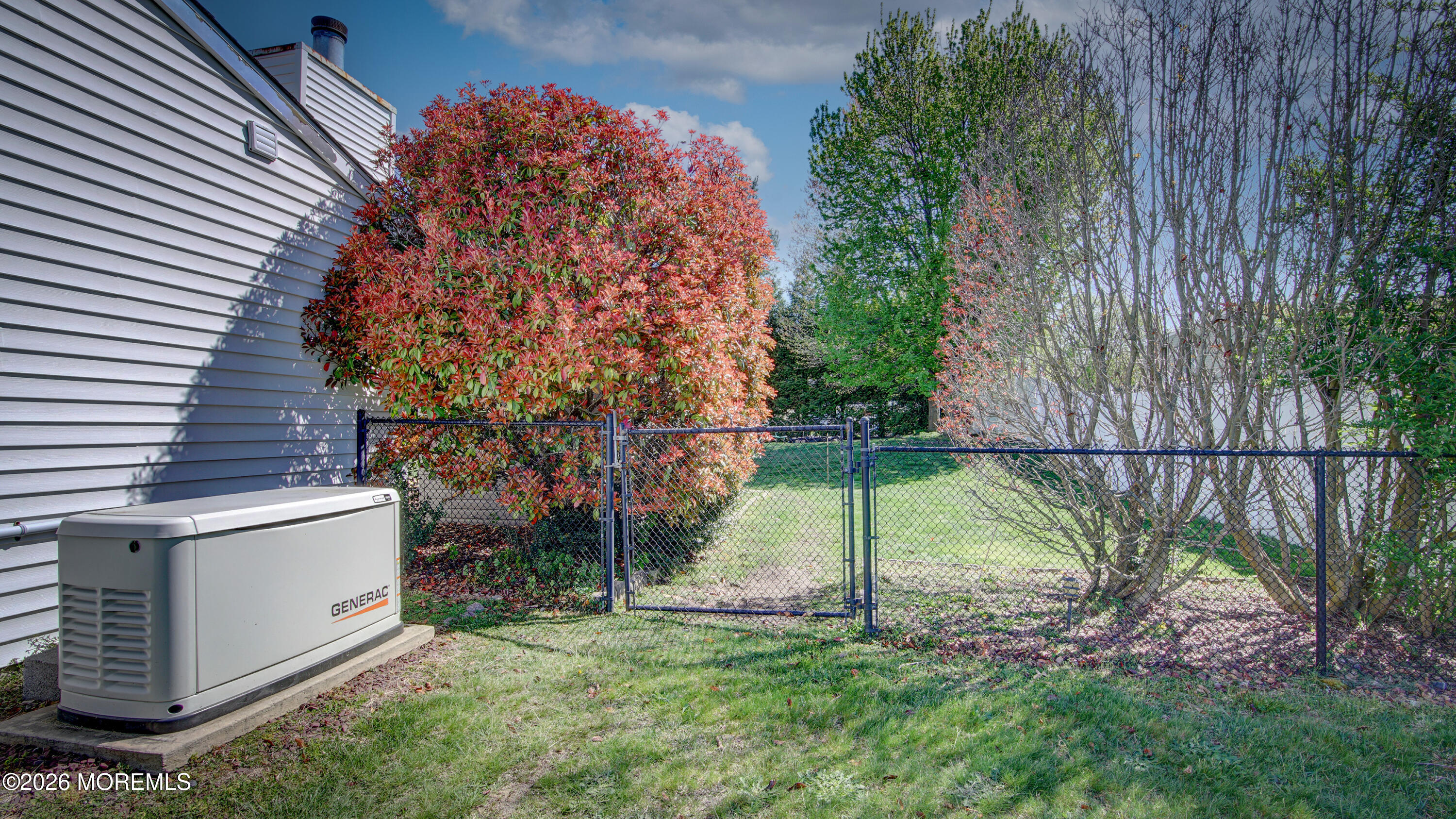128 Starlight Road Howell, NJ 07731 - Photo 31 of 36 a backyard of a house with lots of green space
