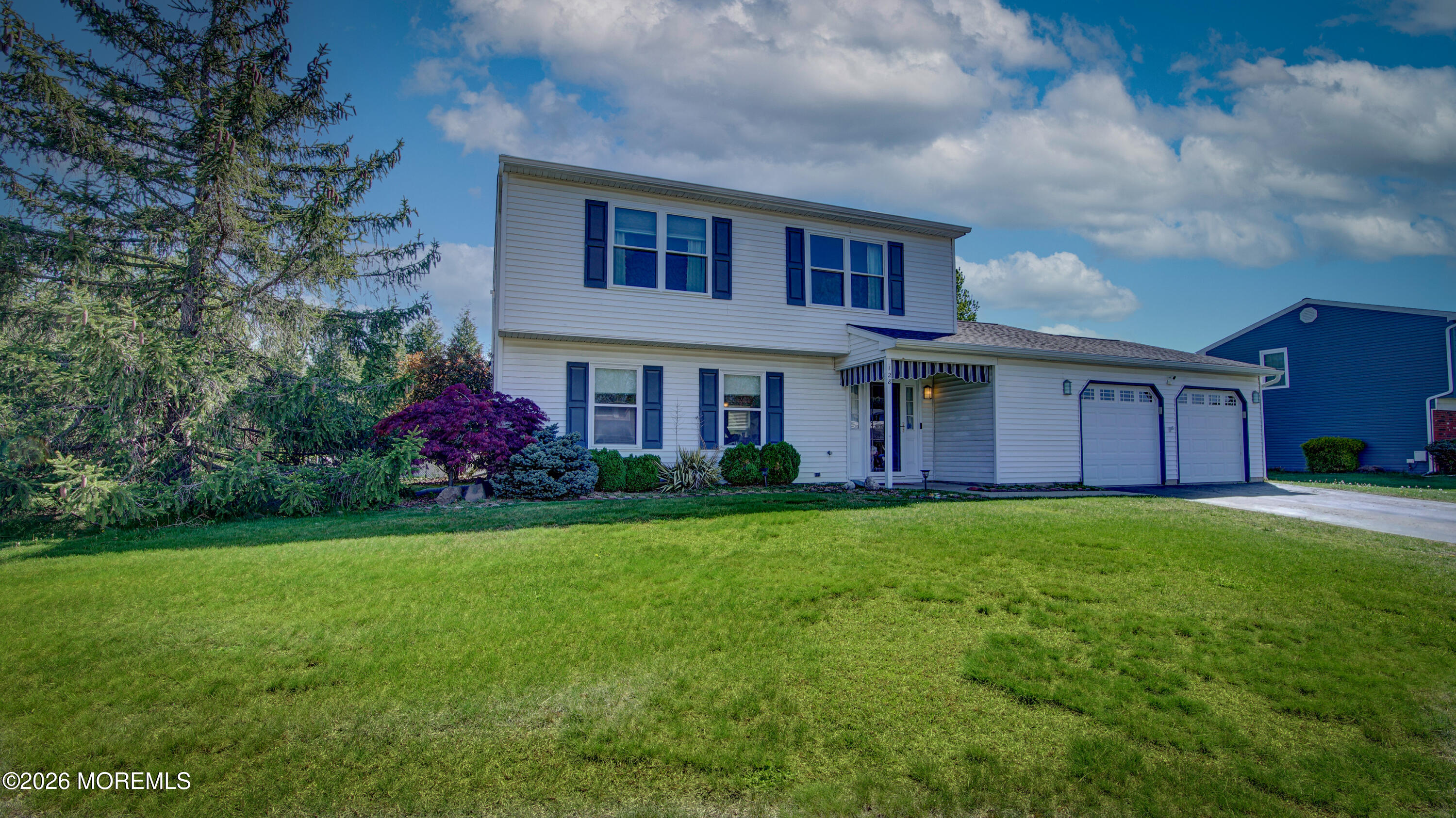 128 Starlight Road Howell, NJ 07731 - Photo 32 of 36 a front view of a house with garden