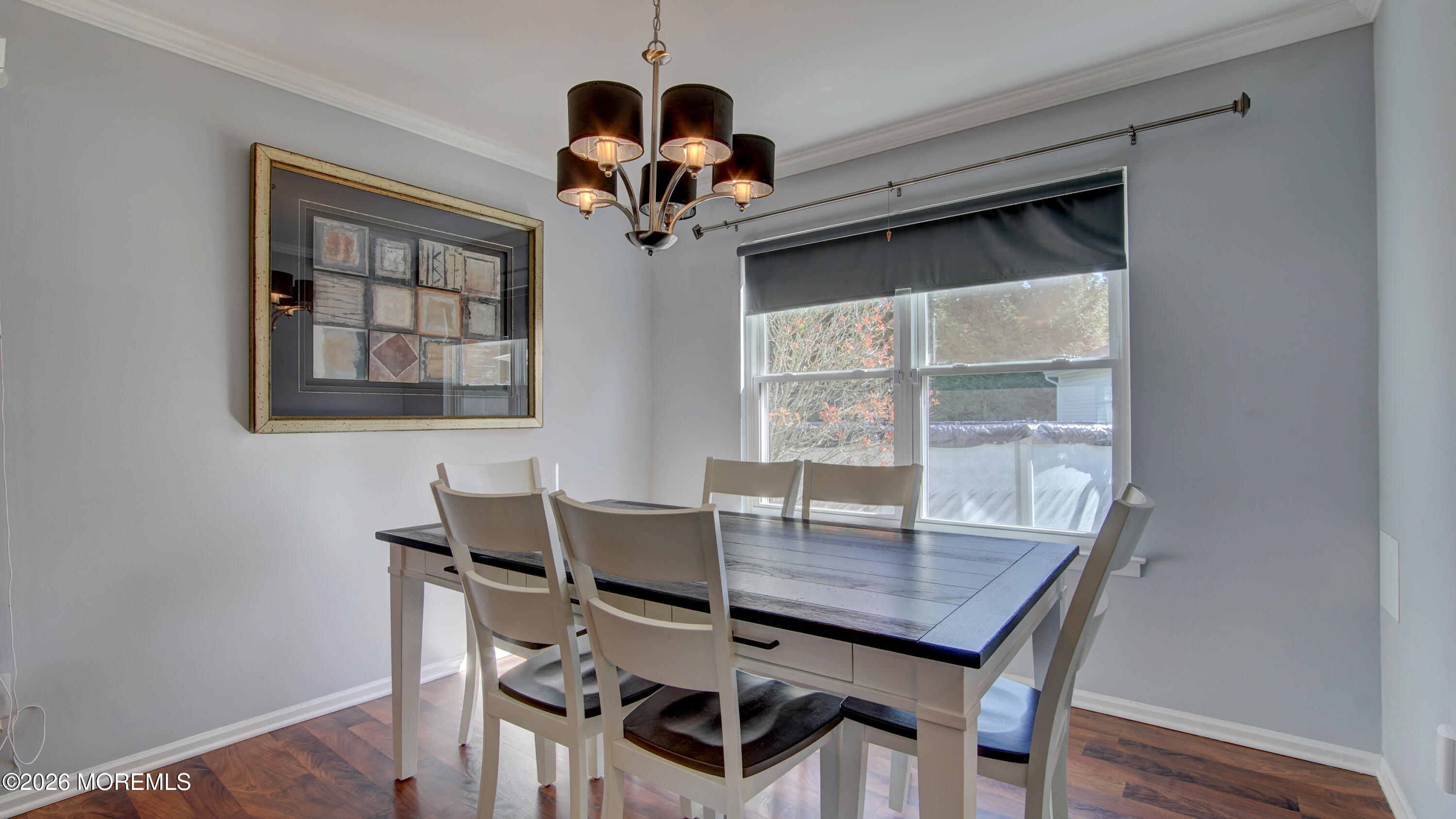 128 Starlight Road Howell, NJ 07731 - Photo 6 of 36 a view of a dining room with furniture wooden floor and chandelier
