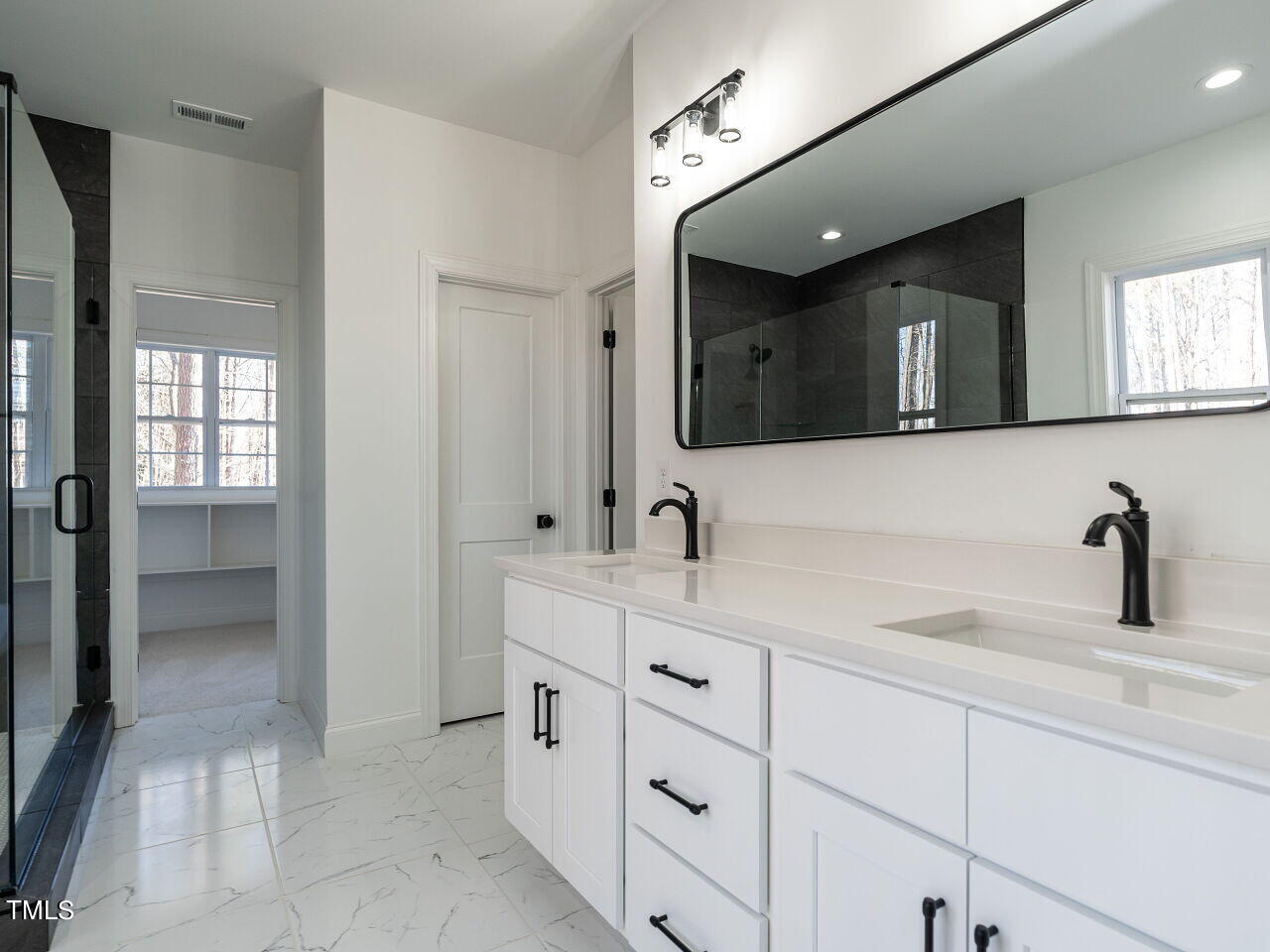 45 Tamaran Ct Spring Spring Hope, NC 27882 - Photo 21 of 37 a bathroom with a sink a vanity a mirror and shower