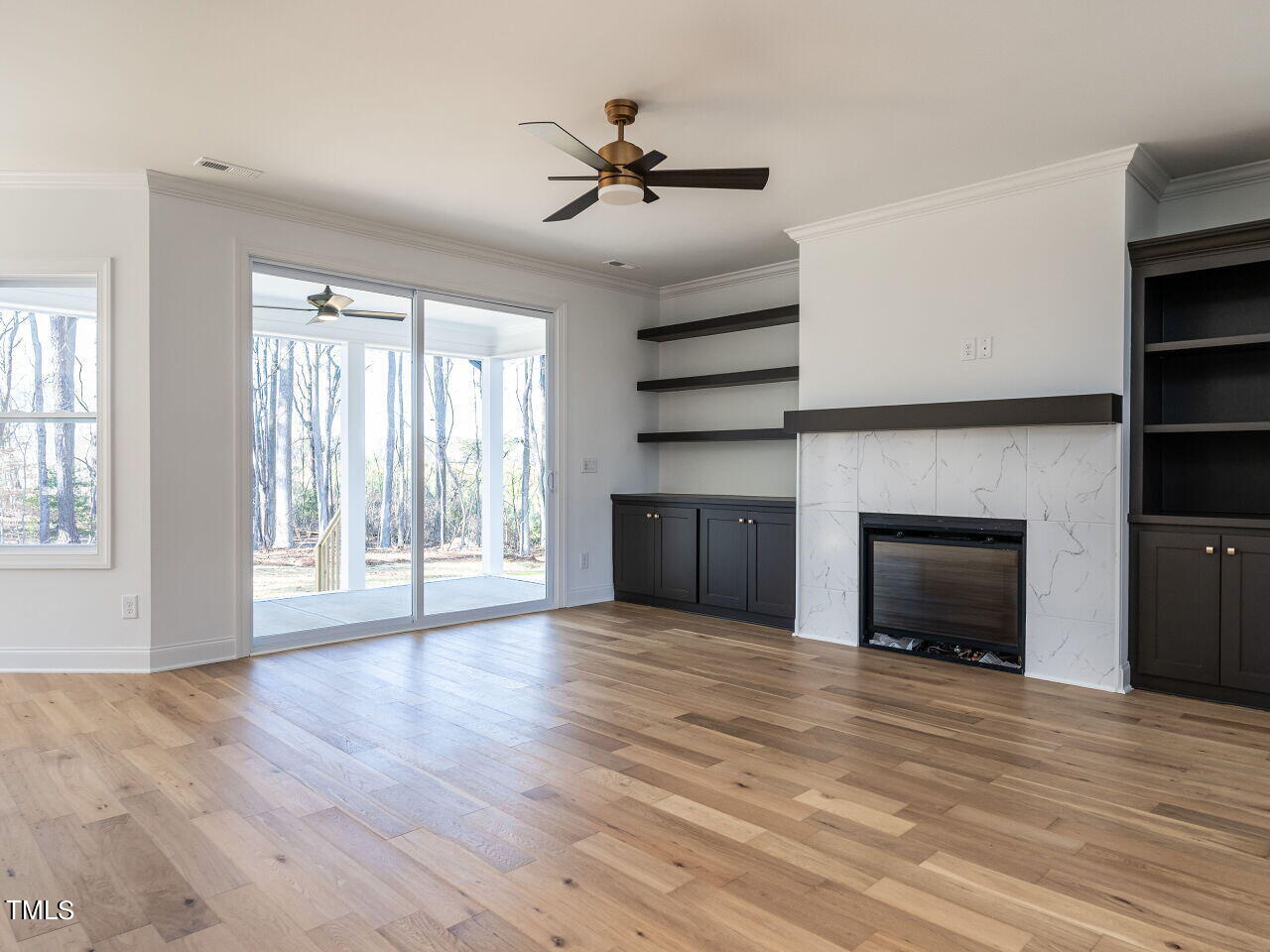 45 Tamaran Ct Spring Spring Hope, NC 27882 - Photo 6 of 37 a view of an empty room with a fireplace and a window