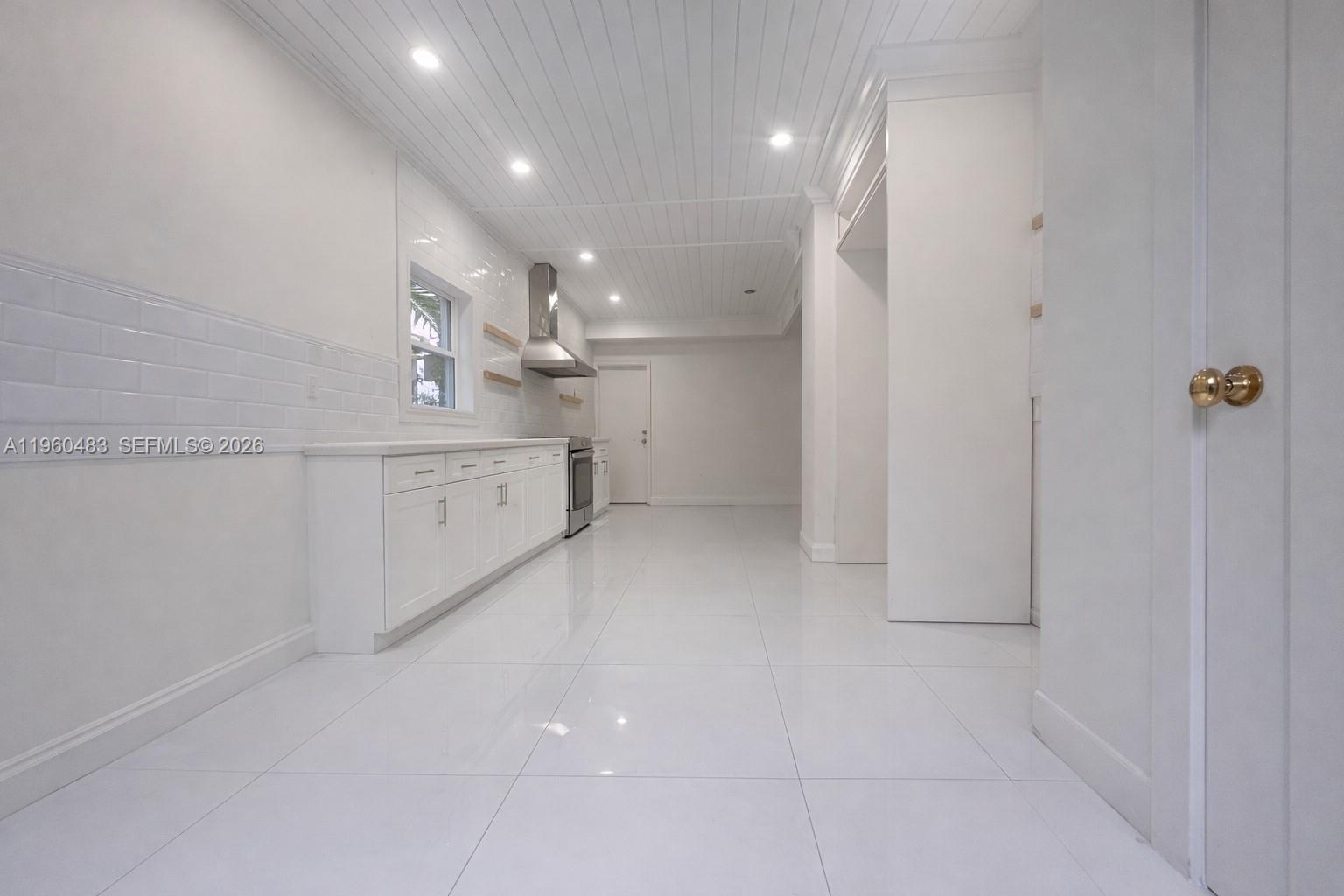 3614 Anderson Road Coral Gables, FL 33134 - Photo 12 of 25 a view of a kitchen with white cabinets