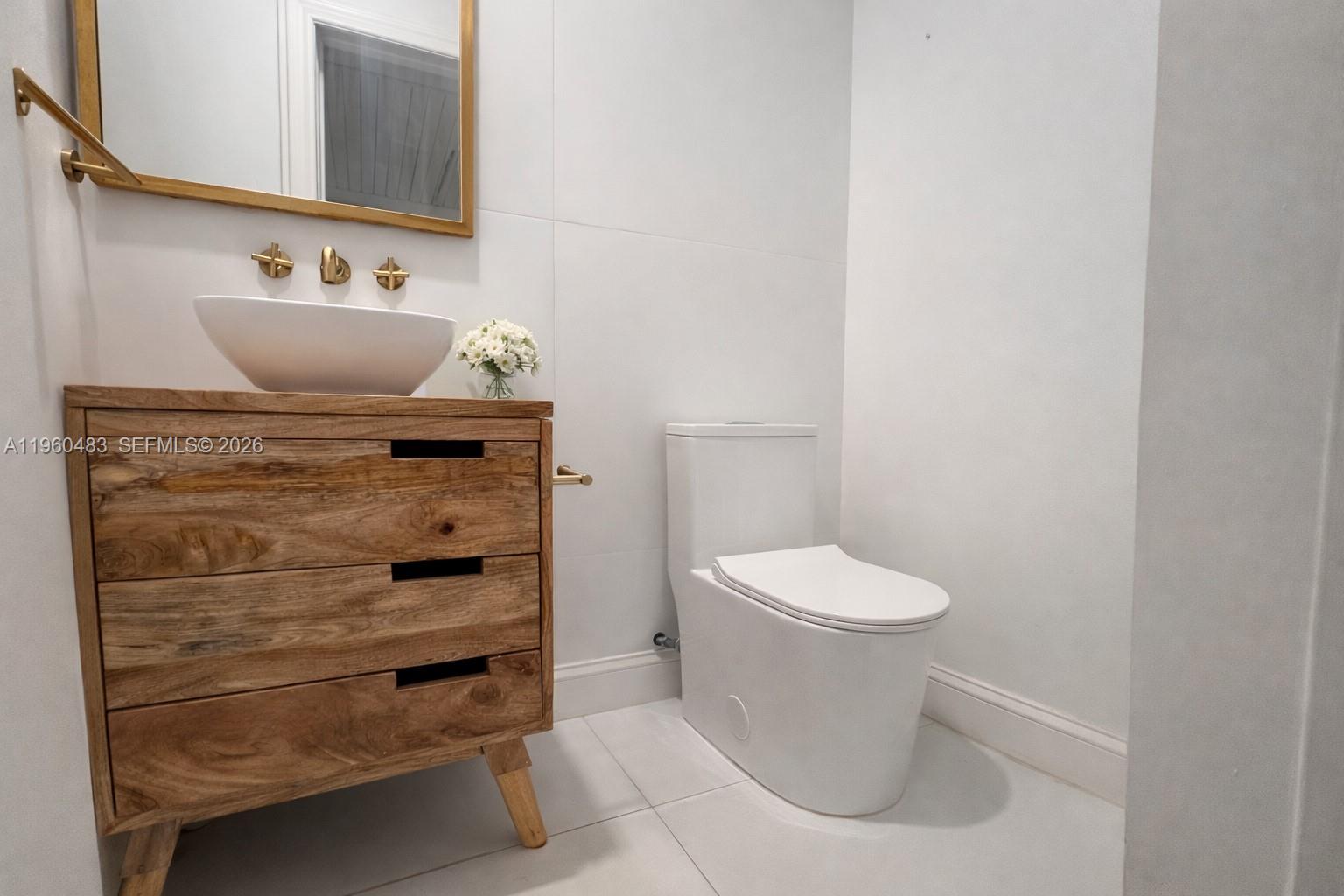 3614 Anderson Road Coral Gables, FL 33134 - Photo 14 of 25 a bathroom with a toilet and a sink