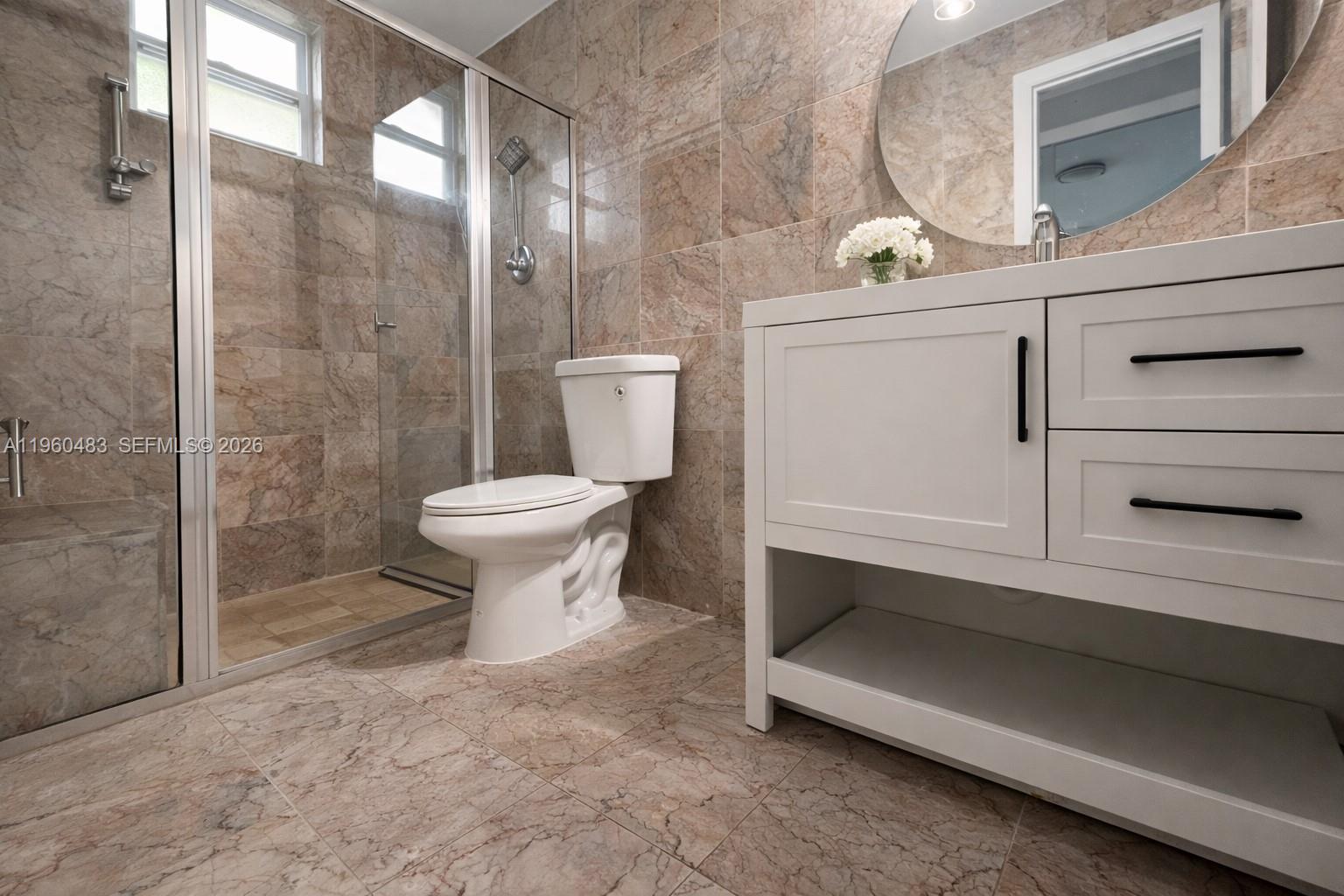 3614 Anderson Road Coral Gables, FL 33134 - Photo 15 of 25 a bathroom with a sink and a toilet