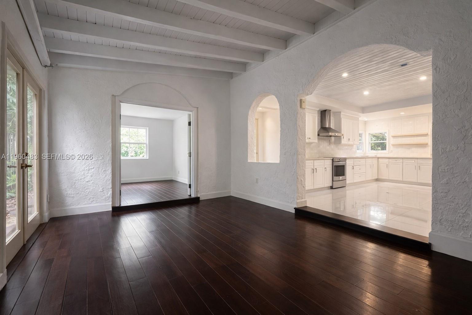 3614 Anderson Road Coral Gables, FL 33134 - Photo 18 of 25 an empty room with wooden floor and windows