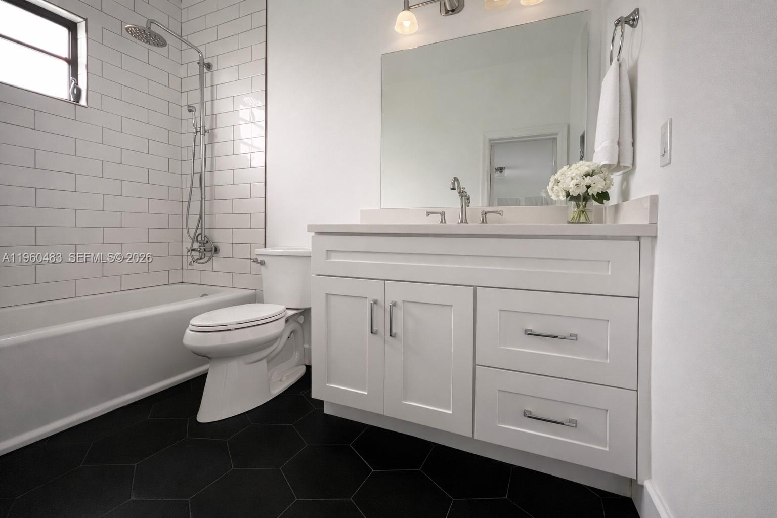 3614 Anderson Road Coral Gables, FL 33134 - Photo 23 of 25 a bathroom with a sink a toilet and bathtub