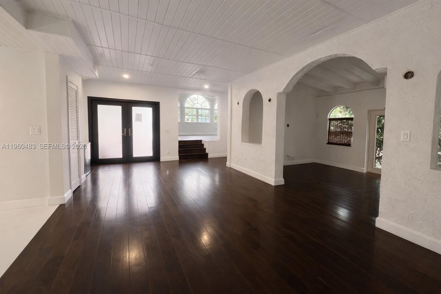 3614 Anderson Road Coral Gables, FL 33134 - Photo 25 of 25 a view of a room with wooden floor and a window