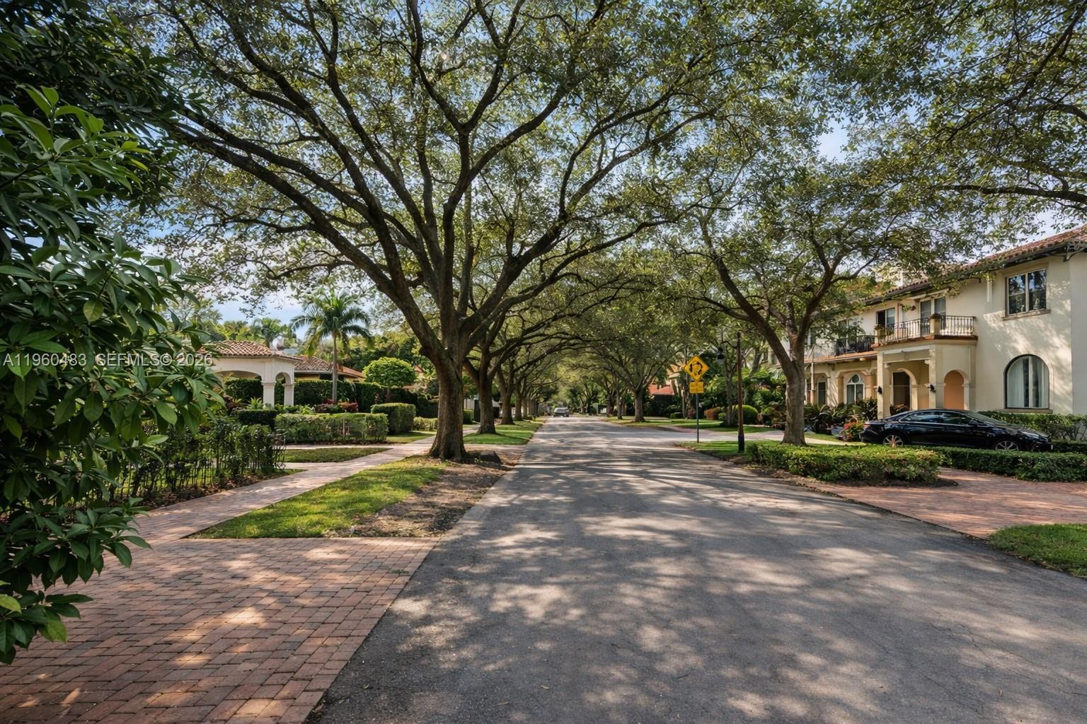 3614 Anderson Road Coral Gables, FL 33134 - Photo 6 of 25 a wooden bench sitting in front of a building