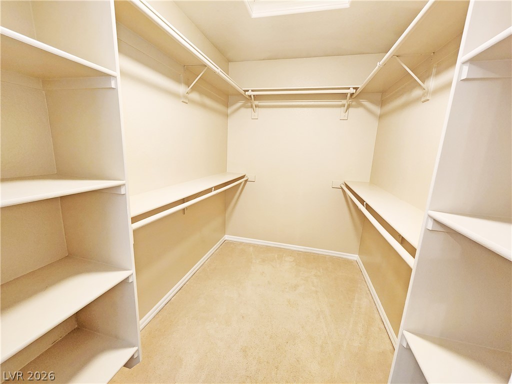 4591 Stoneham Street Pahrump, NV 89061 - Photo 25 of 42 Ample shelving and hanging space defines this well-organized walk-in closet.