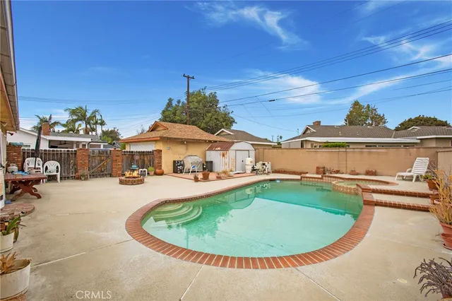 a view of a swimming pool with lounge chair