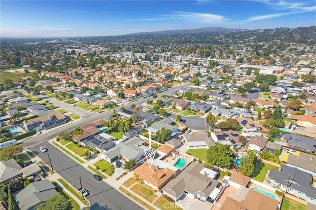 an aerial view of residential building with green space