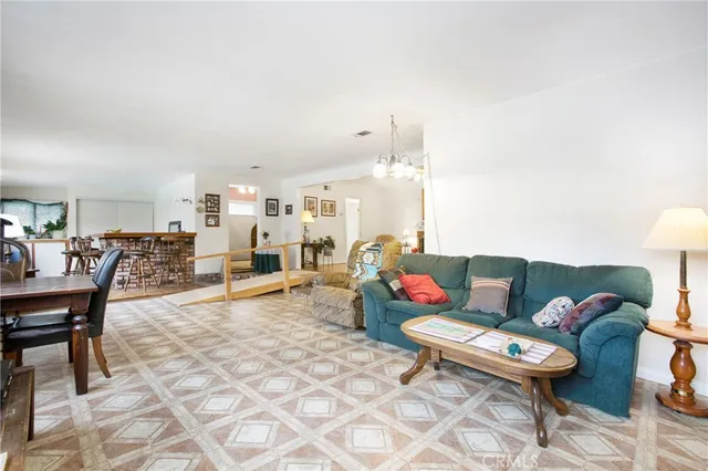 a living room with furniture and a table