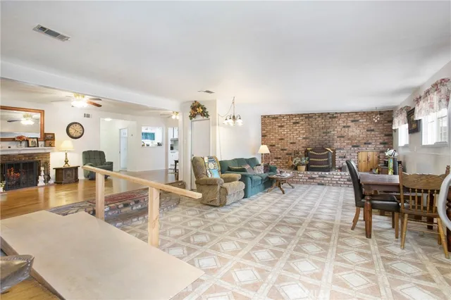 a living room with furniture a rug and white walls