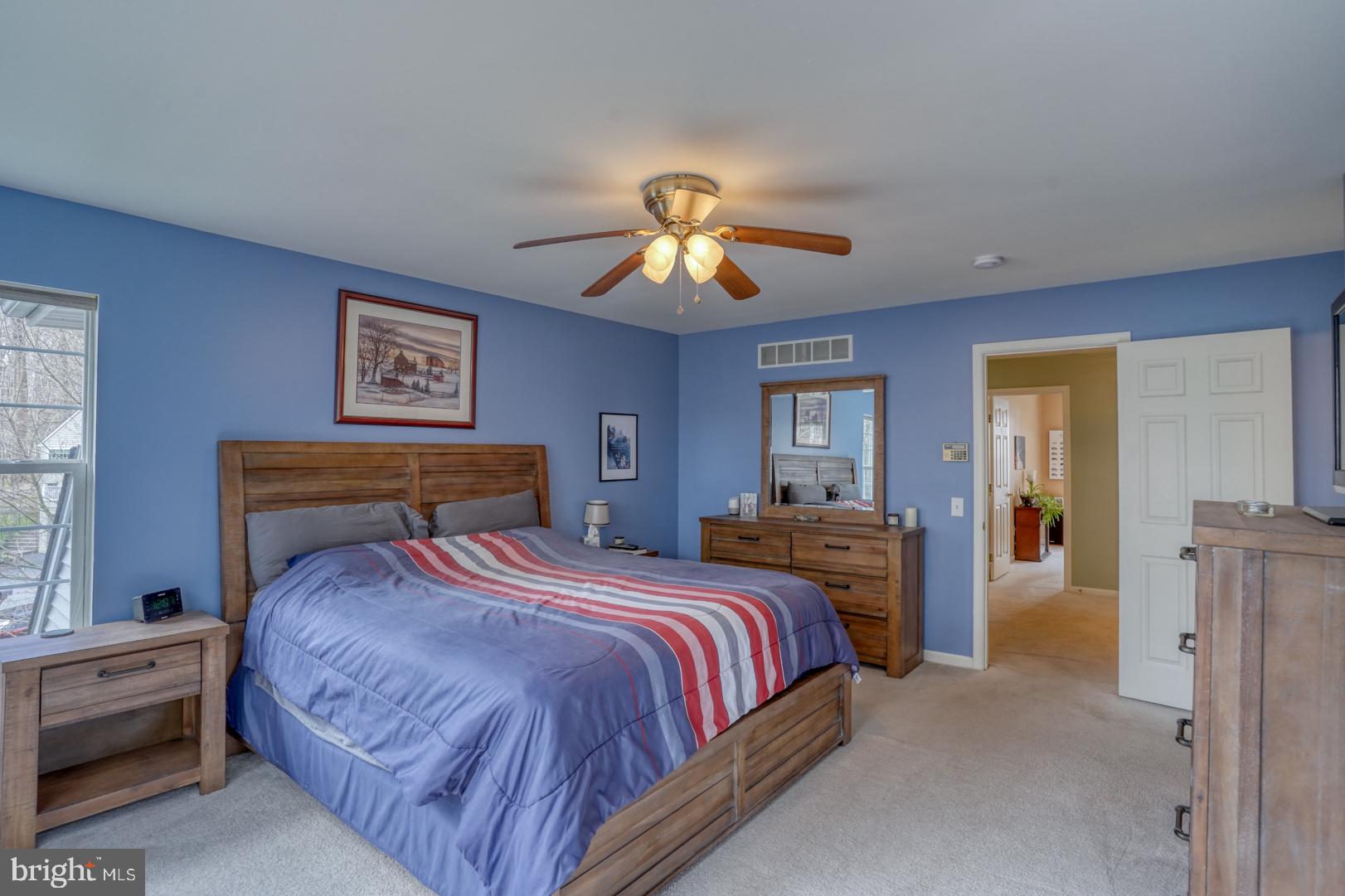 612 Sandy's Parish Road Landenberg, PA 19350 - Photo 32 of 49 a bedroom with bed and a chandelier