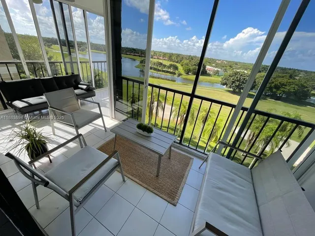 a view of an outdoor sitting area with furniture
