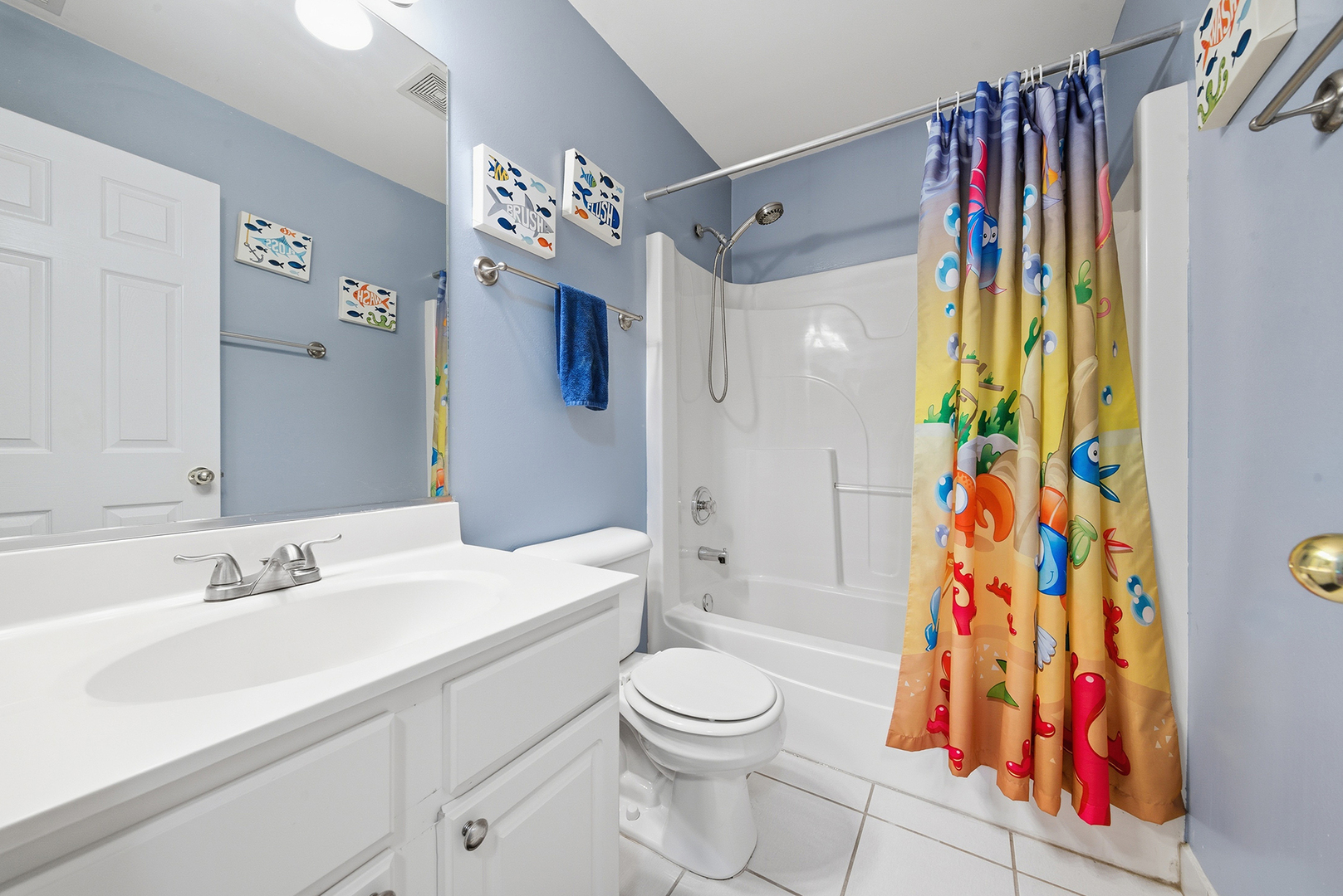 1461 Waterside Drive Bolingbrook, IL 60490 - Photo 17 of 26 a bathroom with a sink a toilet and shower curtain