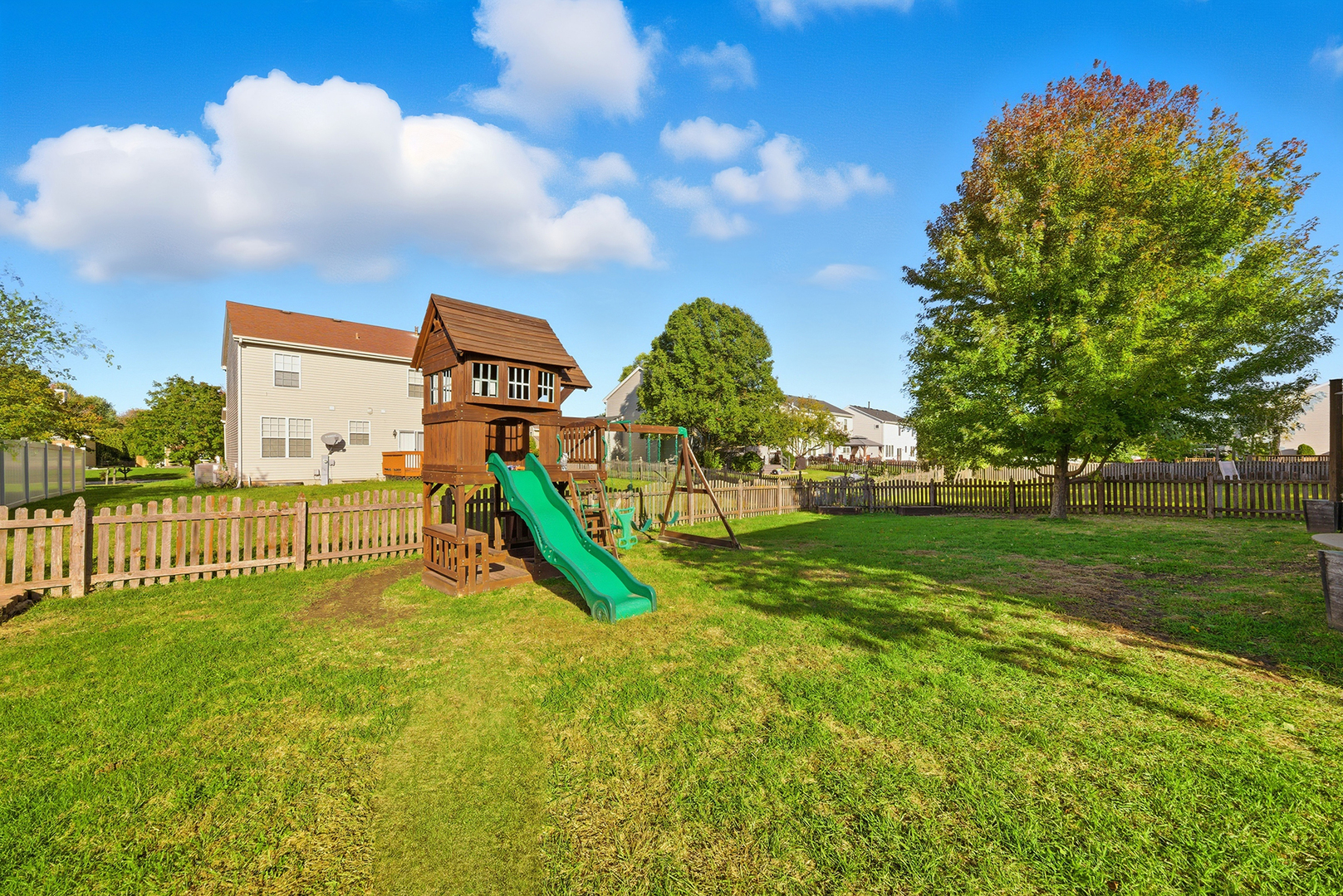 1461 Waterside Drive Bolingbrook, IL 60490 - Photo 24 of 26 a view of a garden with a slide