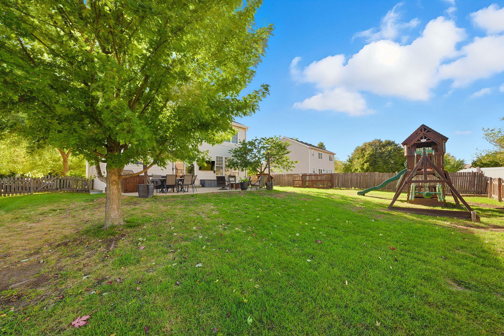 1461 Waterside Drive Bolingbrook, IL 60490 - Photo 25 of 26 a view of a park with swings and slides