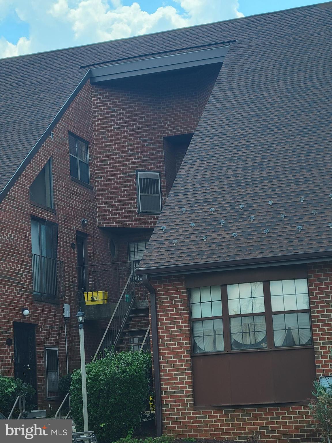 3020 Pineview Court Northeast, Unit 3020 Washington, DC 20018 - Photo 4 of 4 a front view of a house with large windows